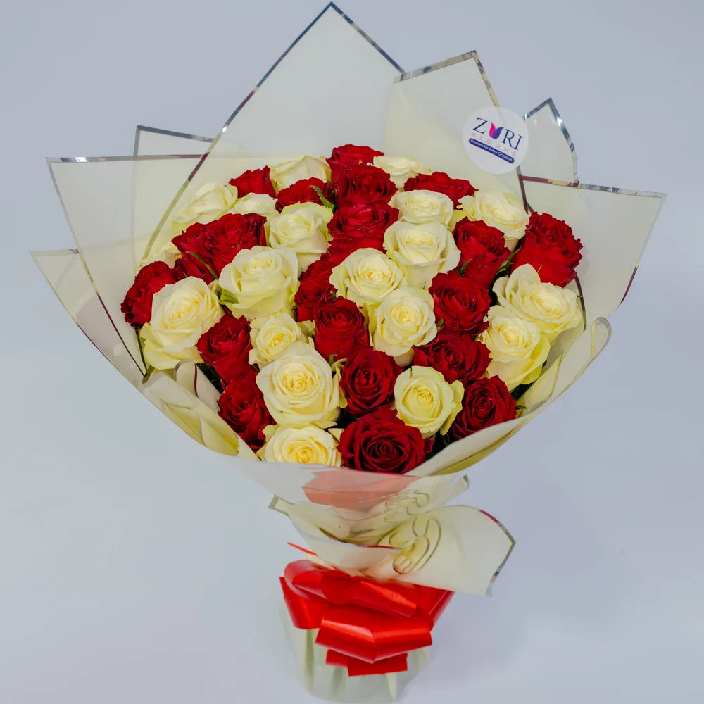 Crimson Bliss bouquet featuring red and white roses classic, arranged by Zuri Blooms