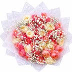Bouquet of pink and white Garden Scented Roses with baby's breath on a white background arranged by Zuri Blooms