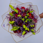 Glamorous Ensemble bouquet featuring red roses, lilies, and purple limonium, arranged by Zuri Blooms