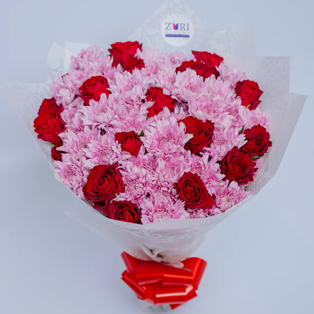 Harmony Radiance bouquet featuring red roses and pink mums, arranged by Zuri Blooms