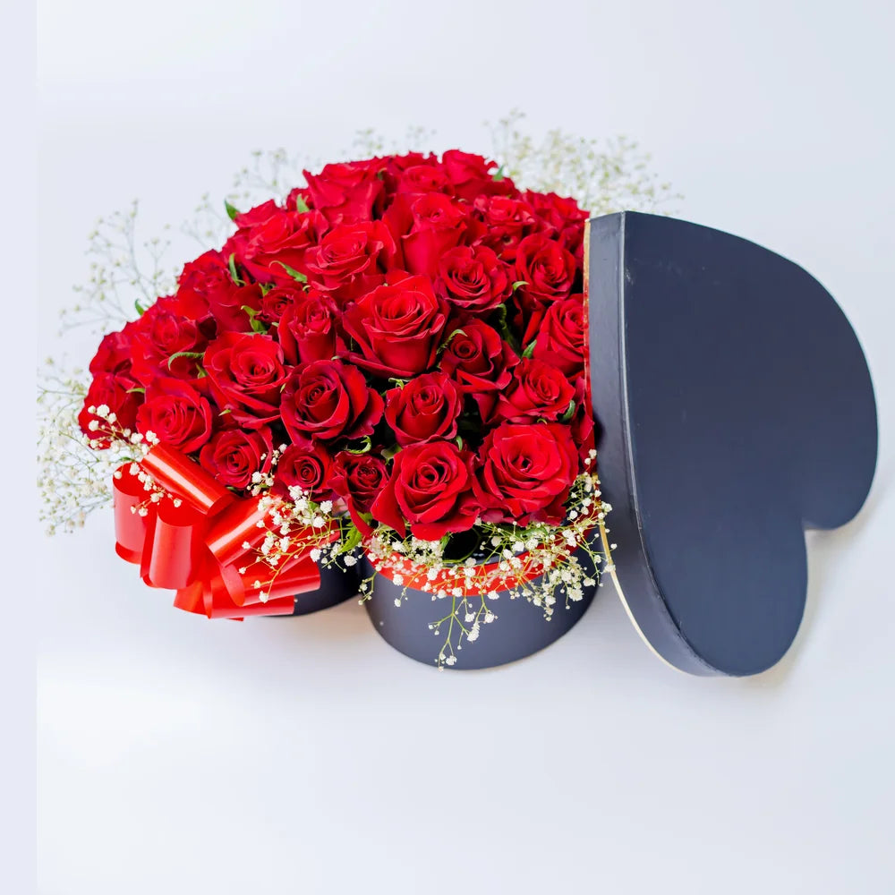 Heartfelt Elegance arrangement featuring red roses in a heart-shaped box, arranged by Zuri Blooms