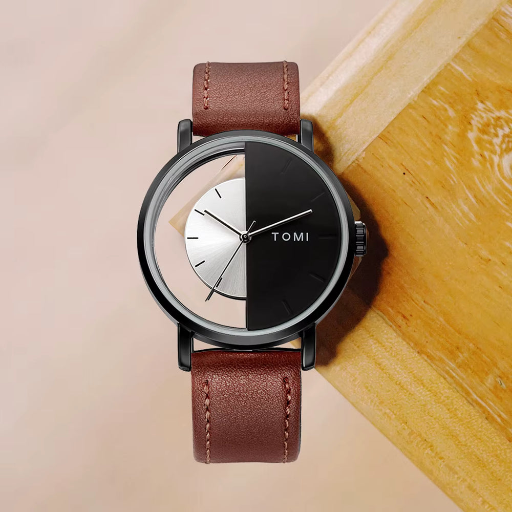 Watch with brown leather strap and black face on a wooden surface