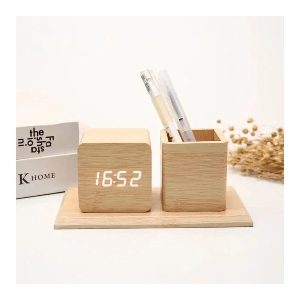 Pen holder with digital clock displaying time, date, and temperature, presented by Zuri Blooms