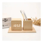 Pen holder with digital clock displaying time, date, and temperature, presented by Zuri Blooms