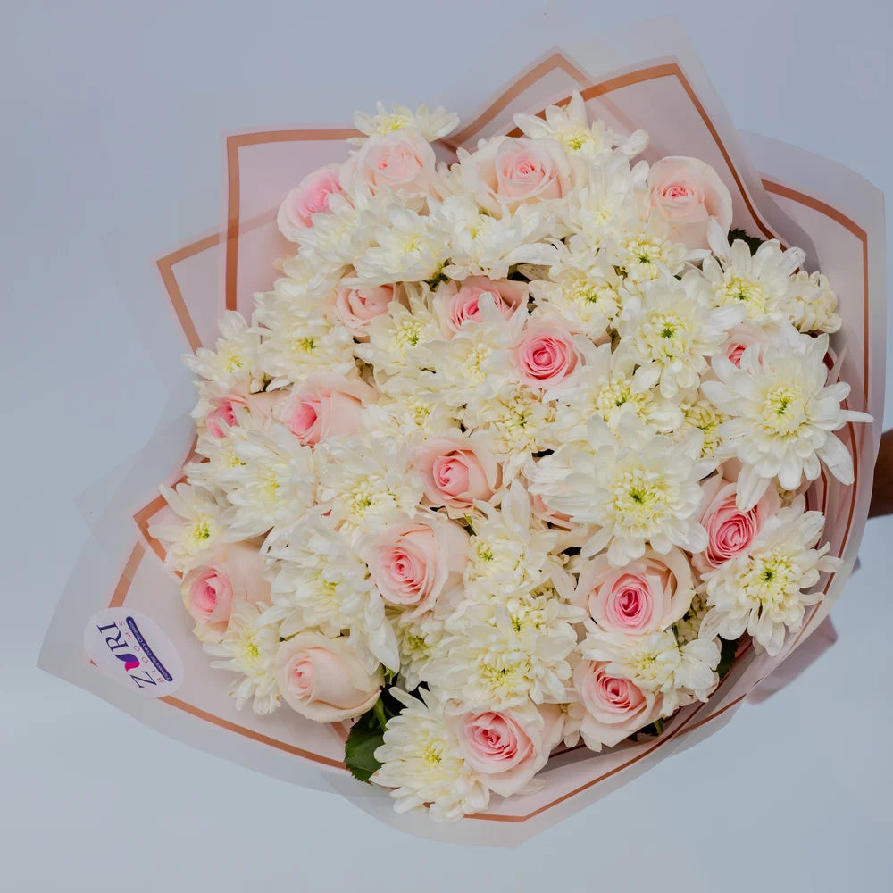 Pink and White Harmony bouquet featuring pink roses and white chrysanthemums front, arranged by Zuri Blooms