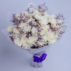Pure Bliss Medley bouquet featuring white chrysanthemums and purple limonium, top, arranged by Zuri Blooms