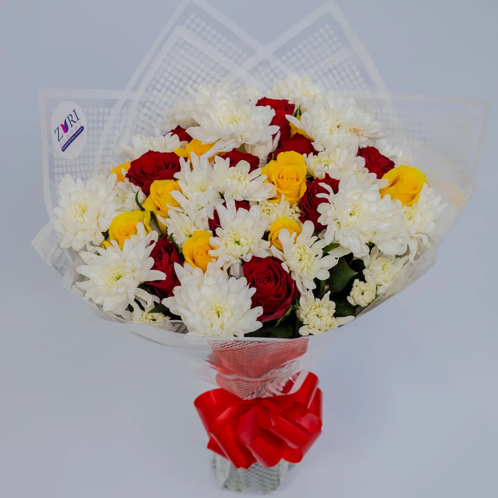 Radiant Sunset bouquet featuring yellow and red roses with white chrysanthemums, arranged by Zuri Blooms