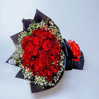 Romantic Rendezvous bouquet featuring red roses and white gypsophila side, arranged by Zuri Blooms
