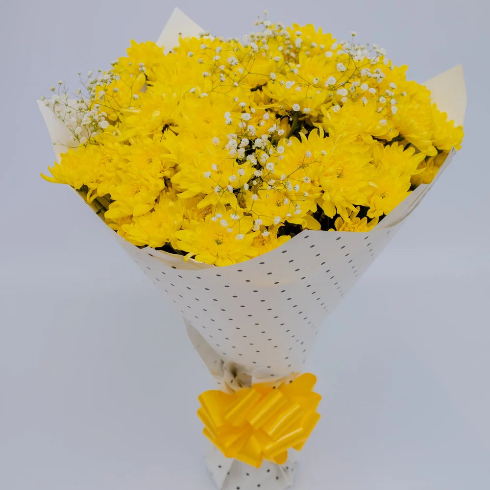 Summer Bliss bouquet featuring yellow mums and white gypsophila top, arranged by Zuri Blooms