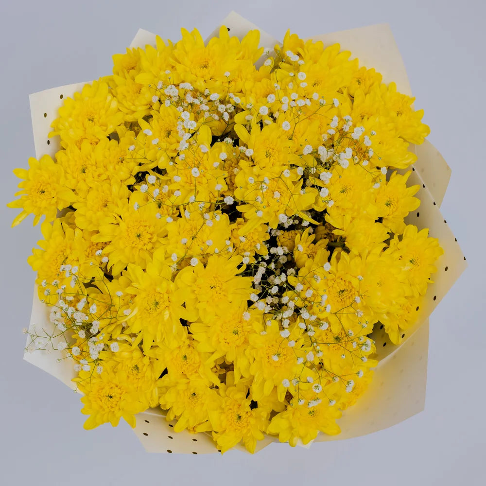 Summer Bliss bouquet featuring yellow mums and white gypsophila front, arranged by Zuri Blooms