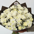 White Ensemble bouquet with white roses, white chrysanthemums, and gypsophila arranged by Zuri Blooms Nairobi